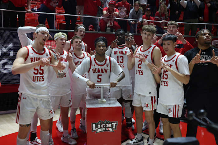 Caption: Jan 21, 2024; Salt Lake City, Utah, USA; Utah Utes guard Deivon Smith (5) Lights the U on the mountain outside of the Jon M. Huntsman Center after defeating the Oregon Ducks. Mandatory Credit: Rob Gray-USA TODAY Sports
